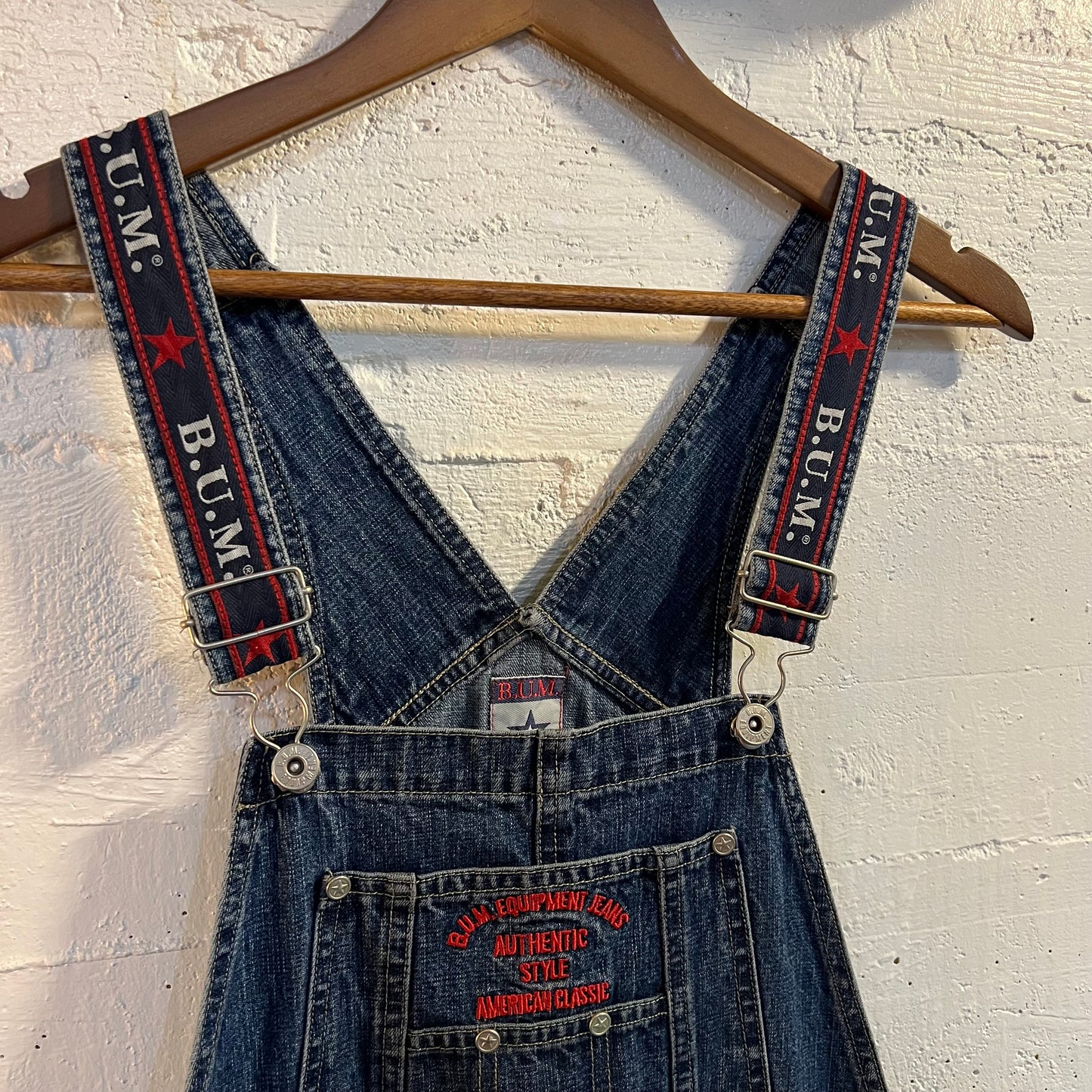 Vintage 90's B.U.M. Equipment Embroidered Spellout Denim Short Overalls - Size Small - Medium Wash Indigo