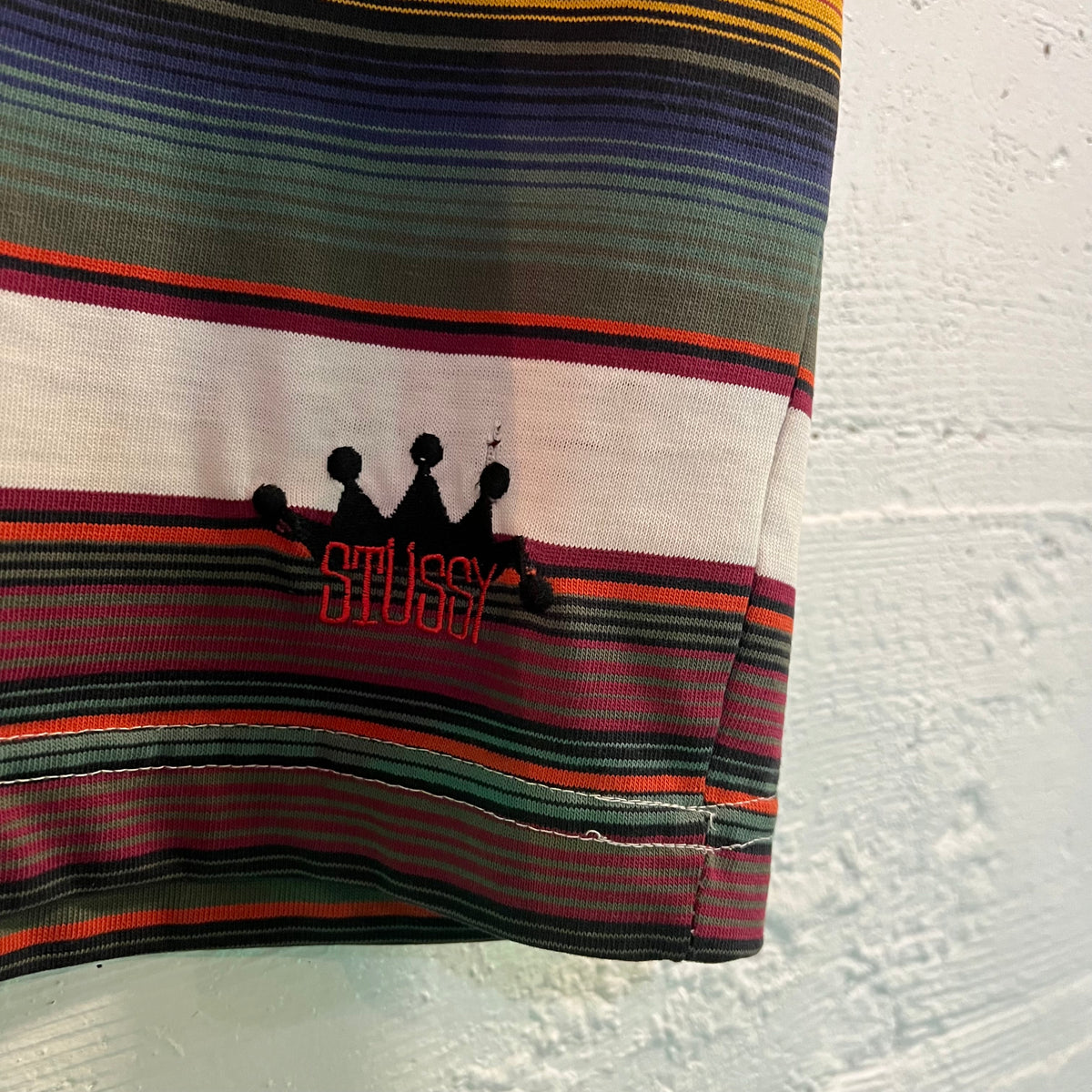 Vintage 80's Stüssy Embroidered Crown Striped Tom Tom Pocket T-Shirt
- Size Medium - Made In USA