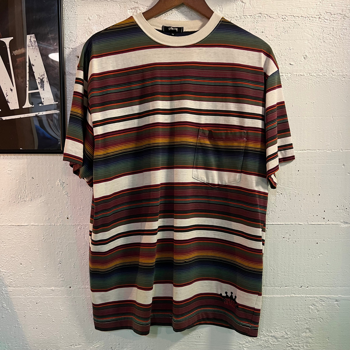 Vintage 80's Stüssy Embroidered Crown Striped Tom Tom Pocket T-Shirt
- Size Medium - Made In USA