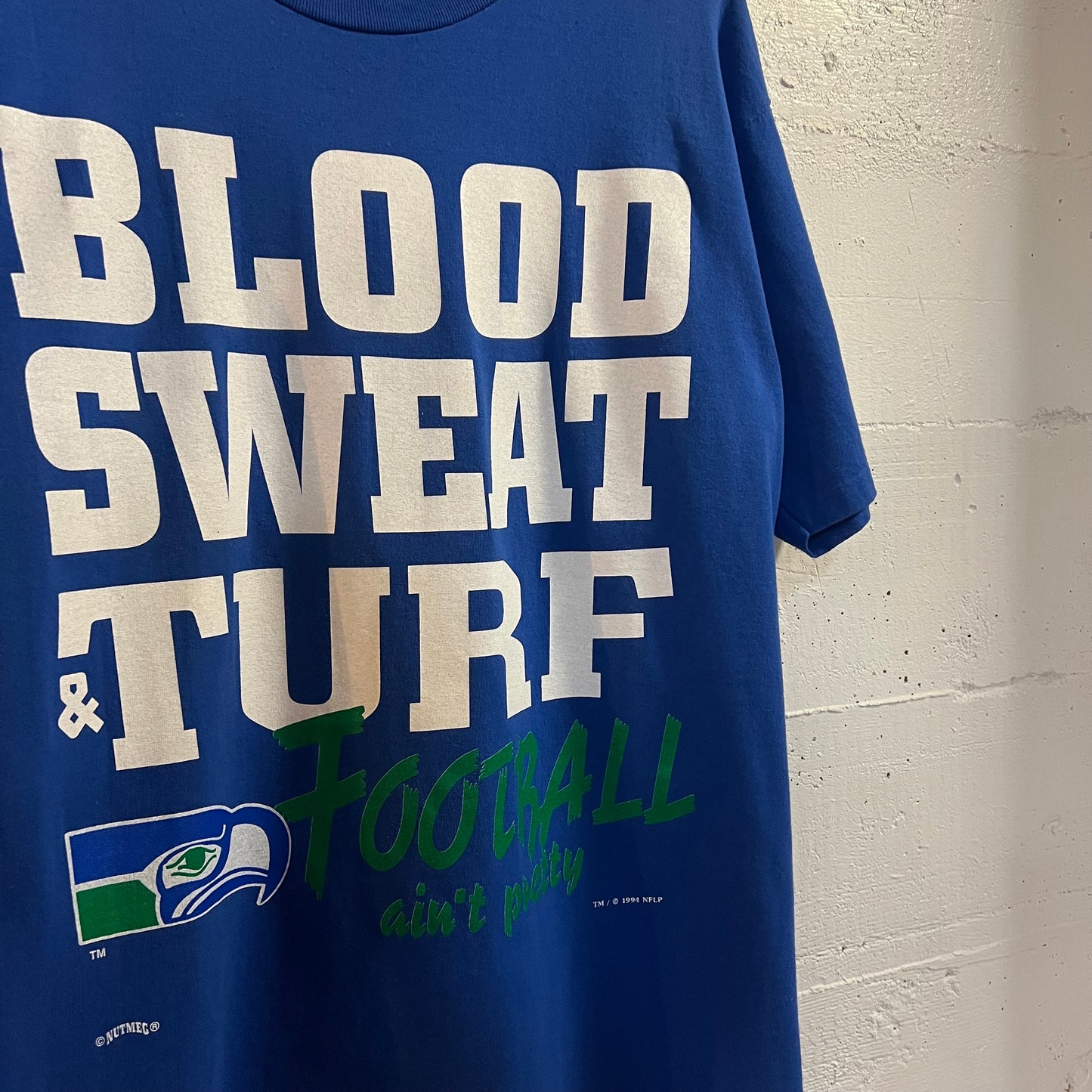 Vintage 1994 NFLP Seattle Seahawks ‘Blood, Sweat & Turf’ Single Stitch T-Shirt - Size Large - Made In USA - Blue/White