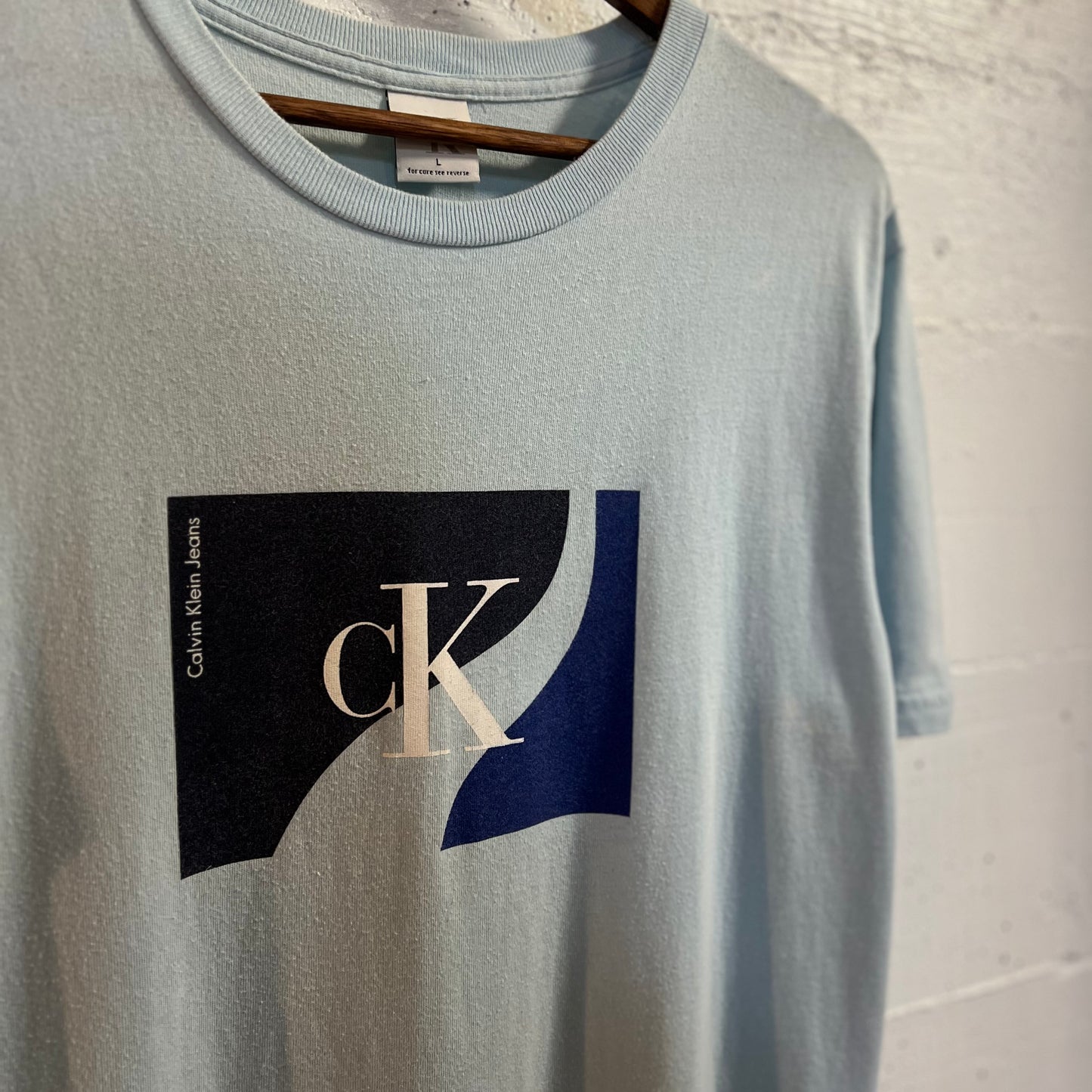 Vintage 90’s Calvin Klein Jeans Graphic T-Shirt - Size Large - Made In USA - Sky Blue