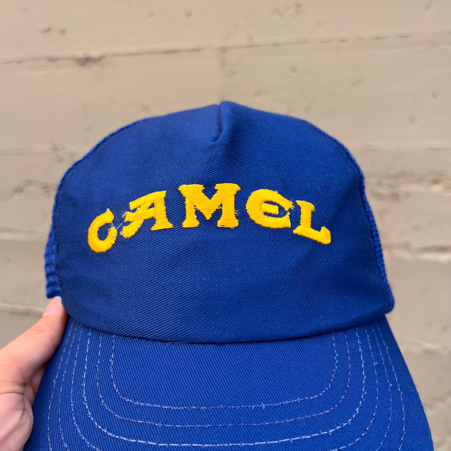 Vintage 90's Camel Embroidered Logo Mesh Back Trucker Hat - O/S - Made In USA - Blue/Yellow