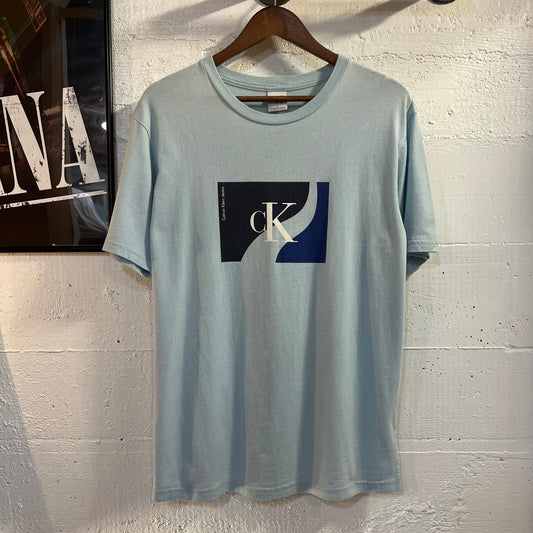 Vintage 90’s Calvin Klein Jeans Graphic T-Shirt - Size Large - Made In USA - Sky Blue